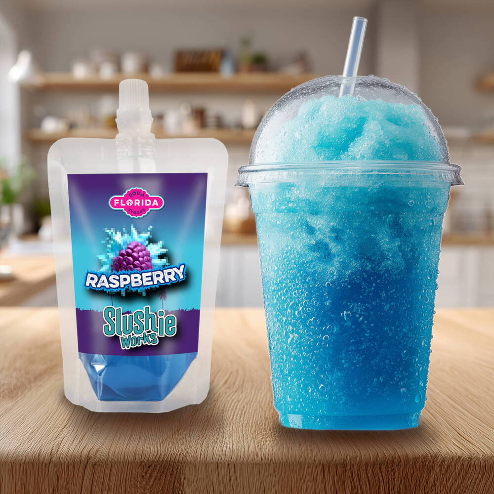 Blue Raspberry Flavour Ninja Slushi Slush Pack on the left with a blue slush drink on the right