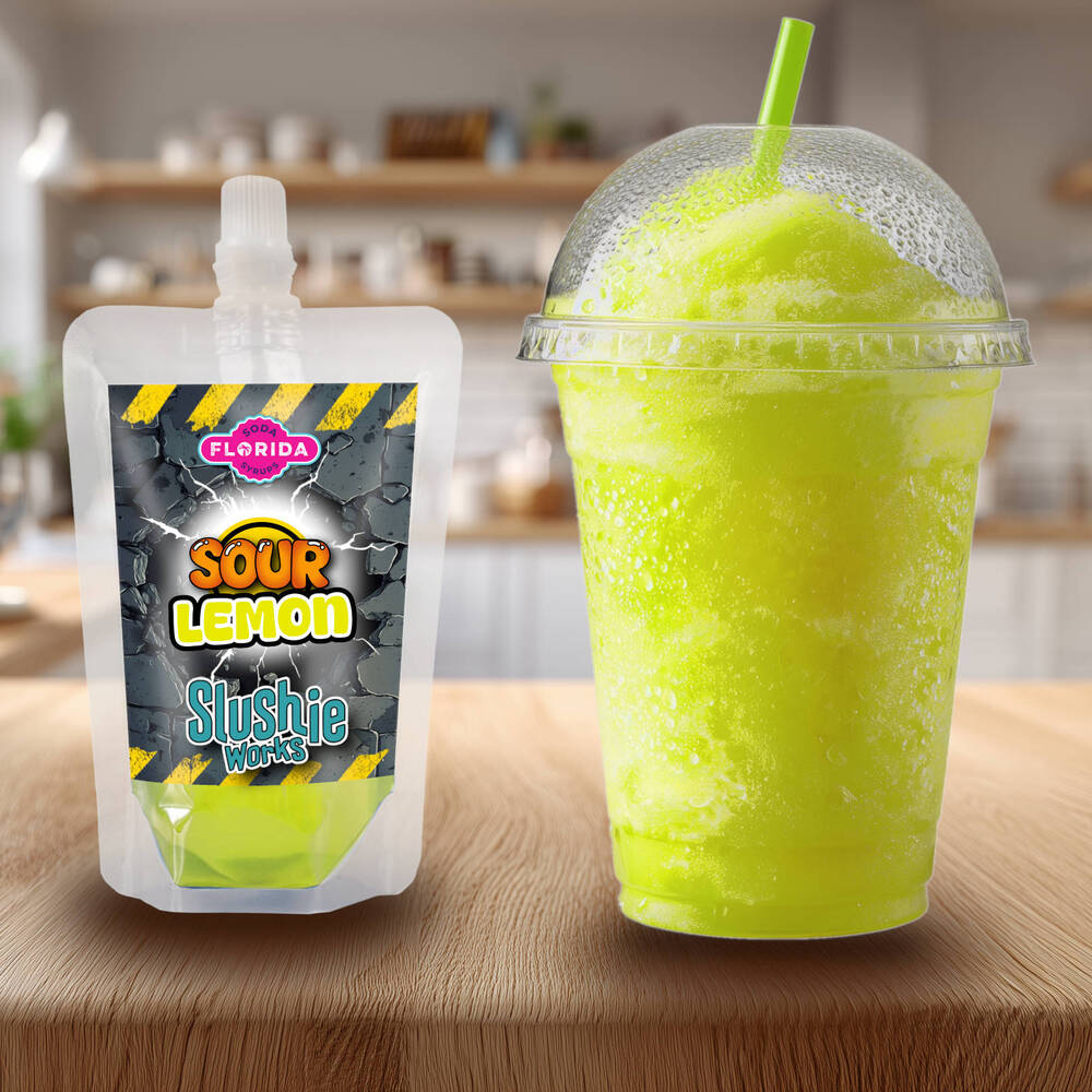 Lemon Sour Flavour Ninja Slushi Slush Pack on the left with a blue slush drink on the right