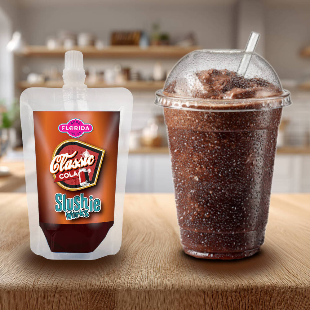 Classic Cola Flavour Ninja Slushi Slush Pack on the left with a blue slush drink on the right